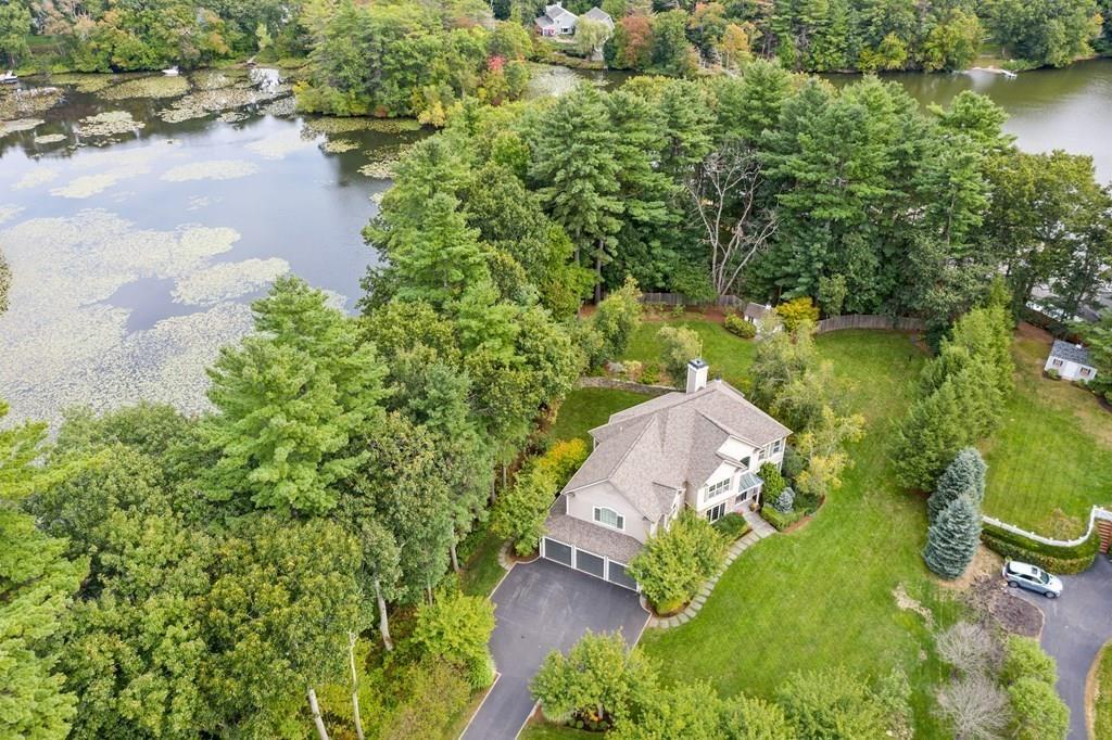7 Pettees Pond Lane Walpole, MA 02081 - Photo 3 of 38 an aerial view of a house with a yard and lake view