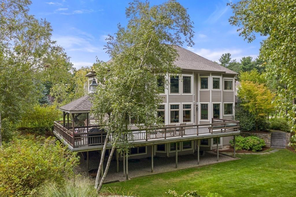 7 Pettees Pond Lane Walpole, MA 02081 - Photo 31 of 38 a view of a house with a backyard and sitting area