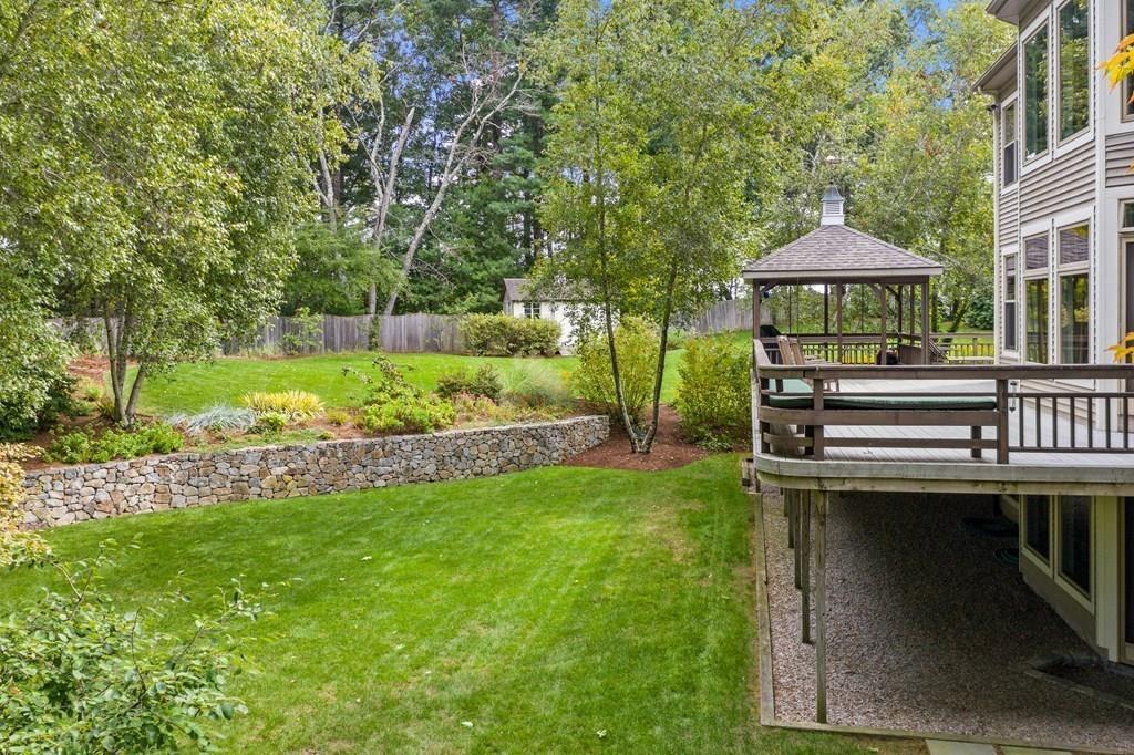 7 Pettees Pond Lane Walpole, MA 02081 - Photo 33 of 38 a view of a house with backyard and sitting area