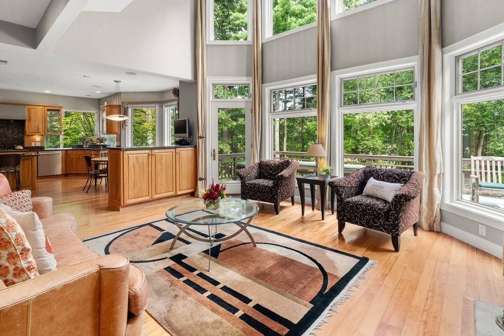 7 Pettees Pond Lane Walpole, MA 02081 - Photo 9 of 38 a living room with furniture and a large window