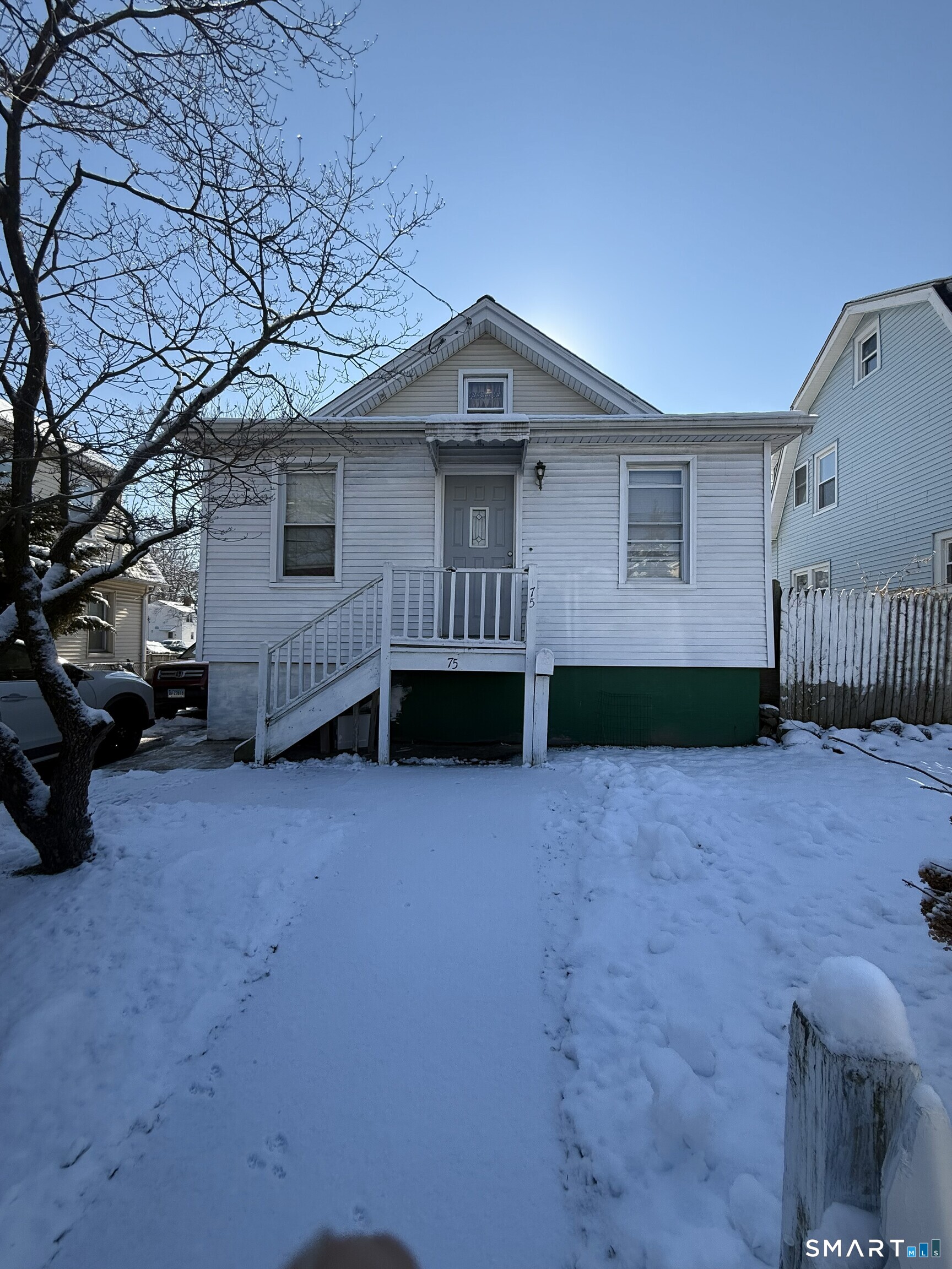 75 Frank Street Stamford, CT 06902 - Photo 1 of 21 a view of a house with a yard