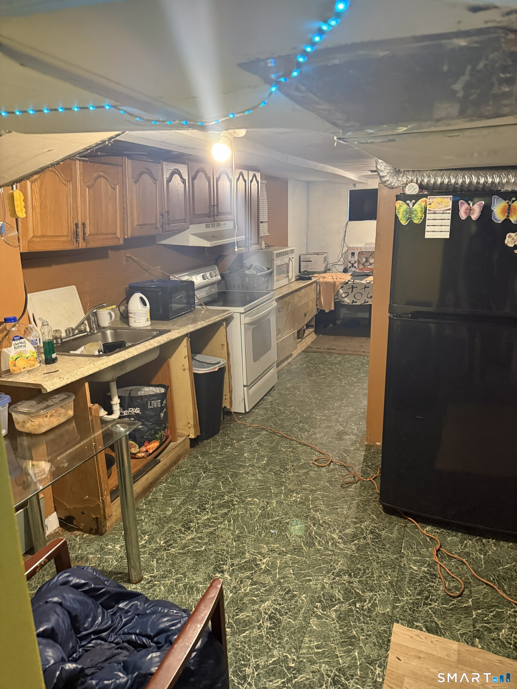 75 Frank Street Stamford, CT 06902 - Photo 14 of 21 a kitchen with stainless steel appliances granite countertop a refrigerator and a stove