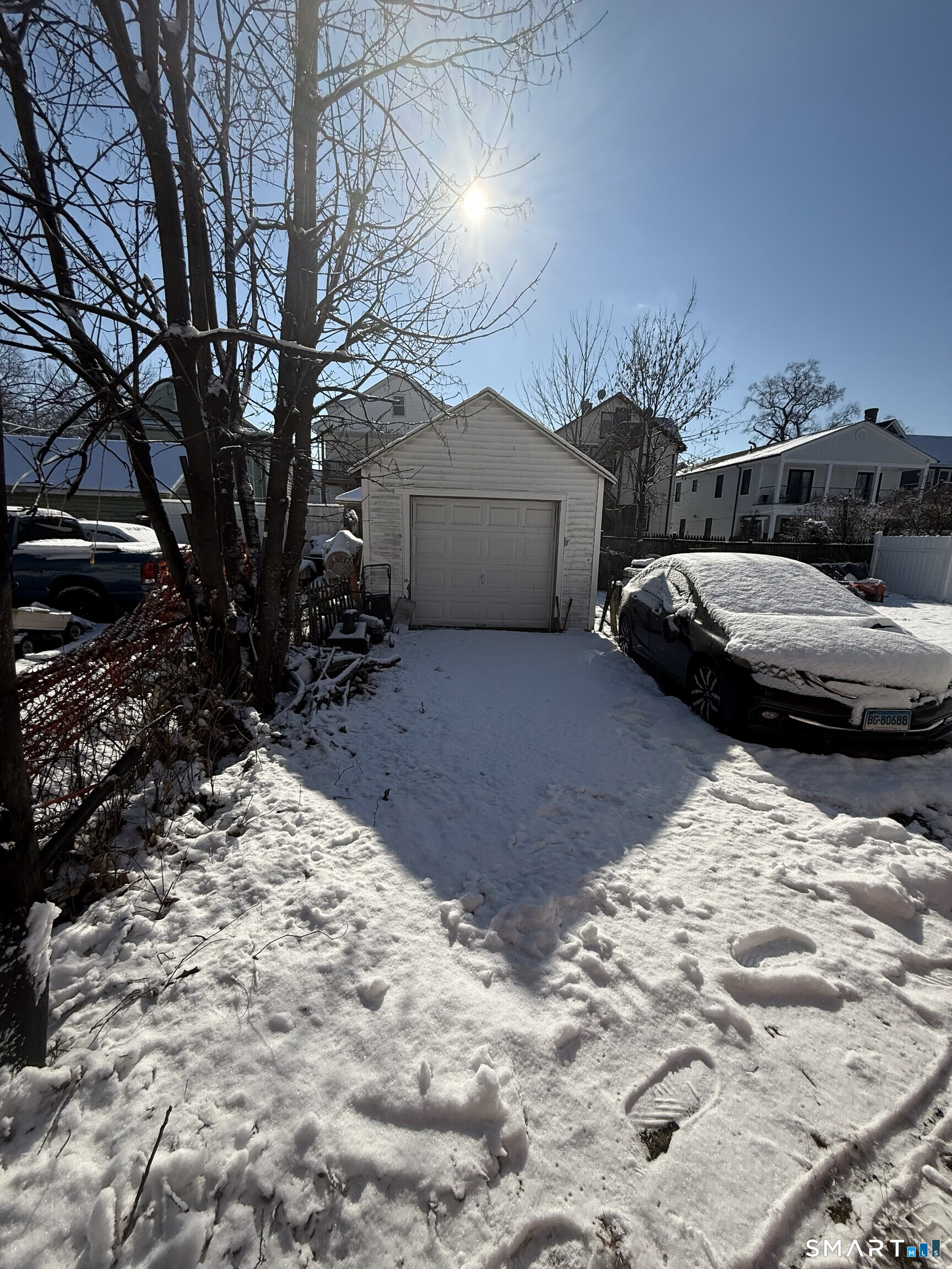 75 Frank Street Stamford, CT 06902 - Photo 20 of 21 a couple of cars parked in front of a house