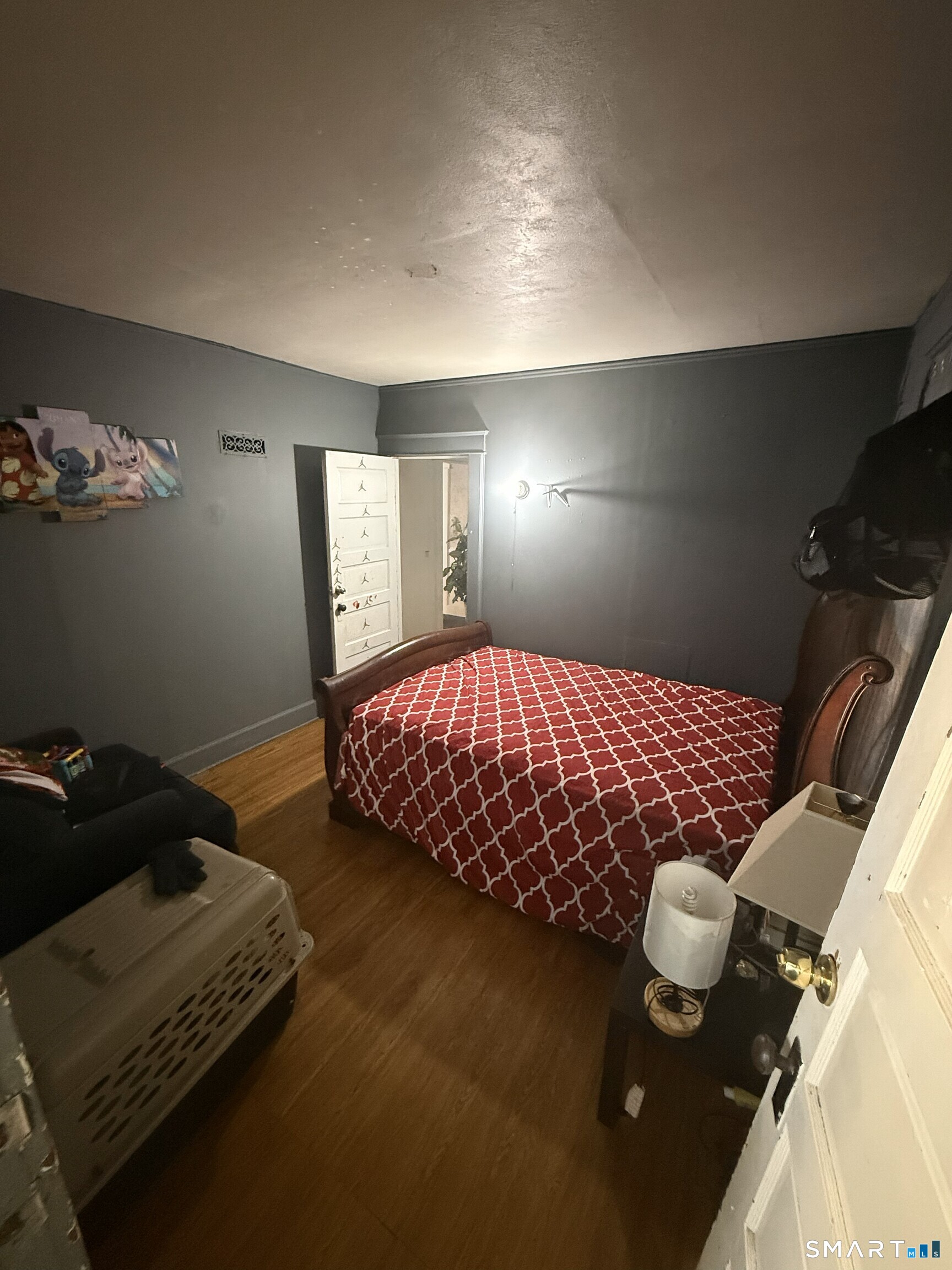 75 Frank Street Stamford, CT 06902 - Photo 6 of 21 a bedroom with a bed and a night stand