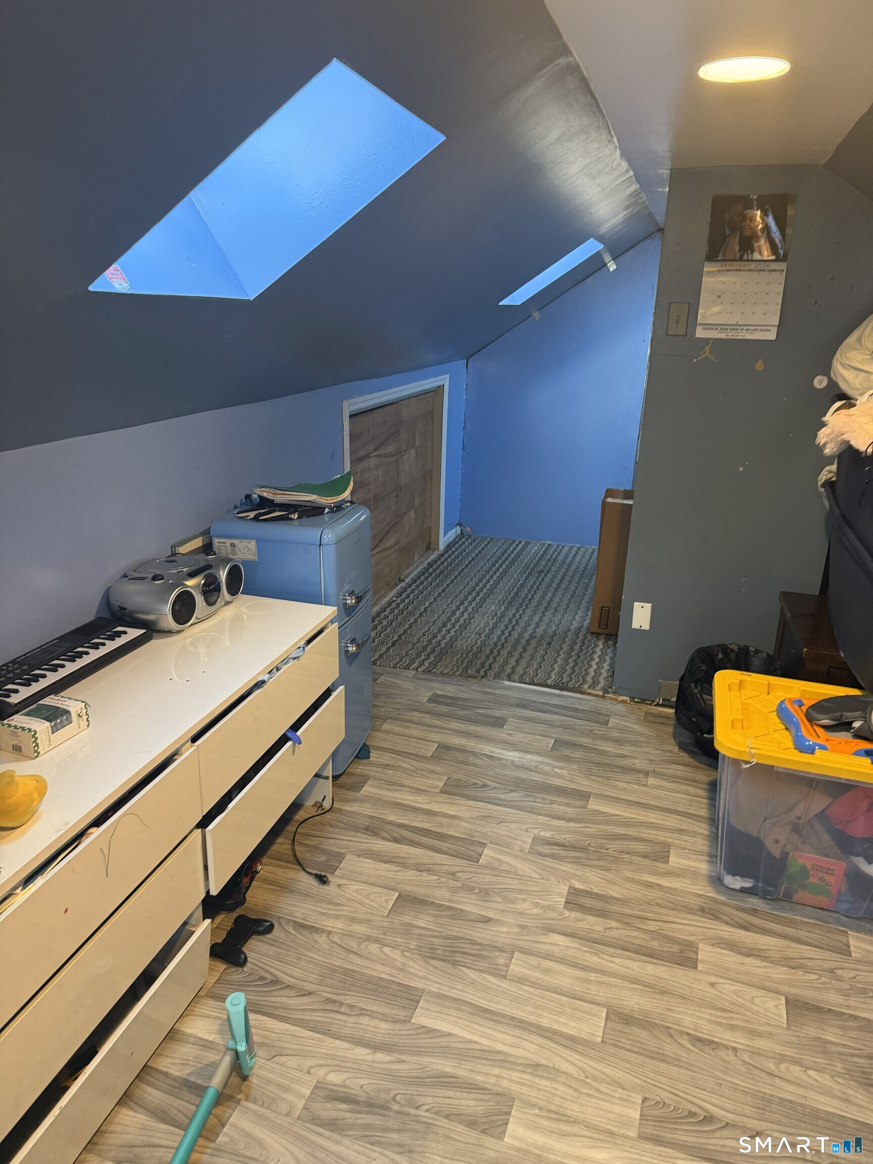 75 Frank Street Stamford, CT 06902 - Photo 9 of 21 a room with a bed and a table