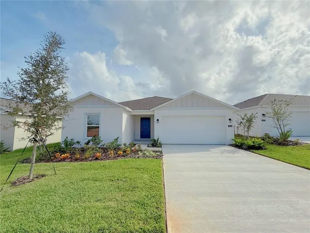 a front view of house with garden