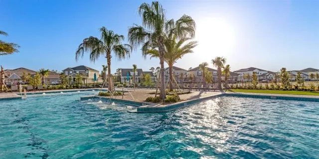 a view of swimming pool with outdoor seating and yard