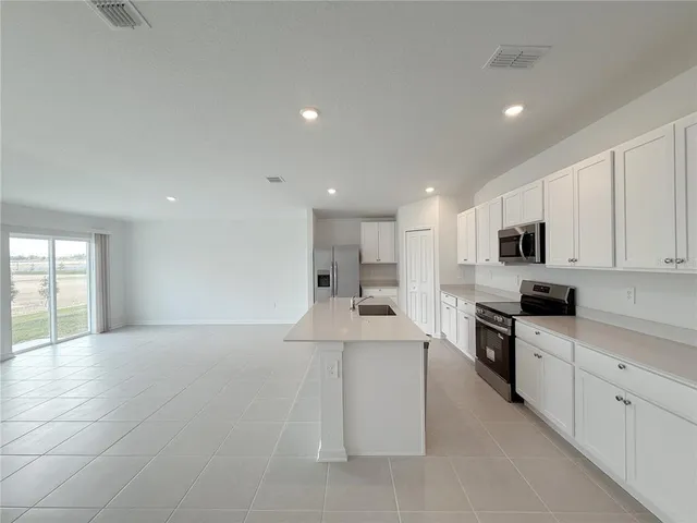 a large kitchen with cabinets