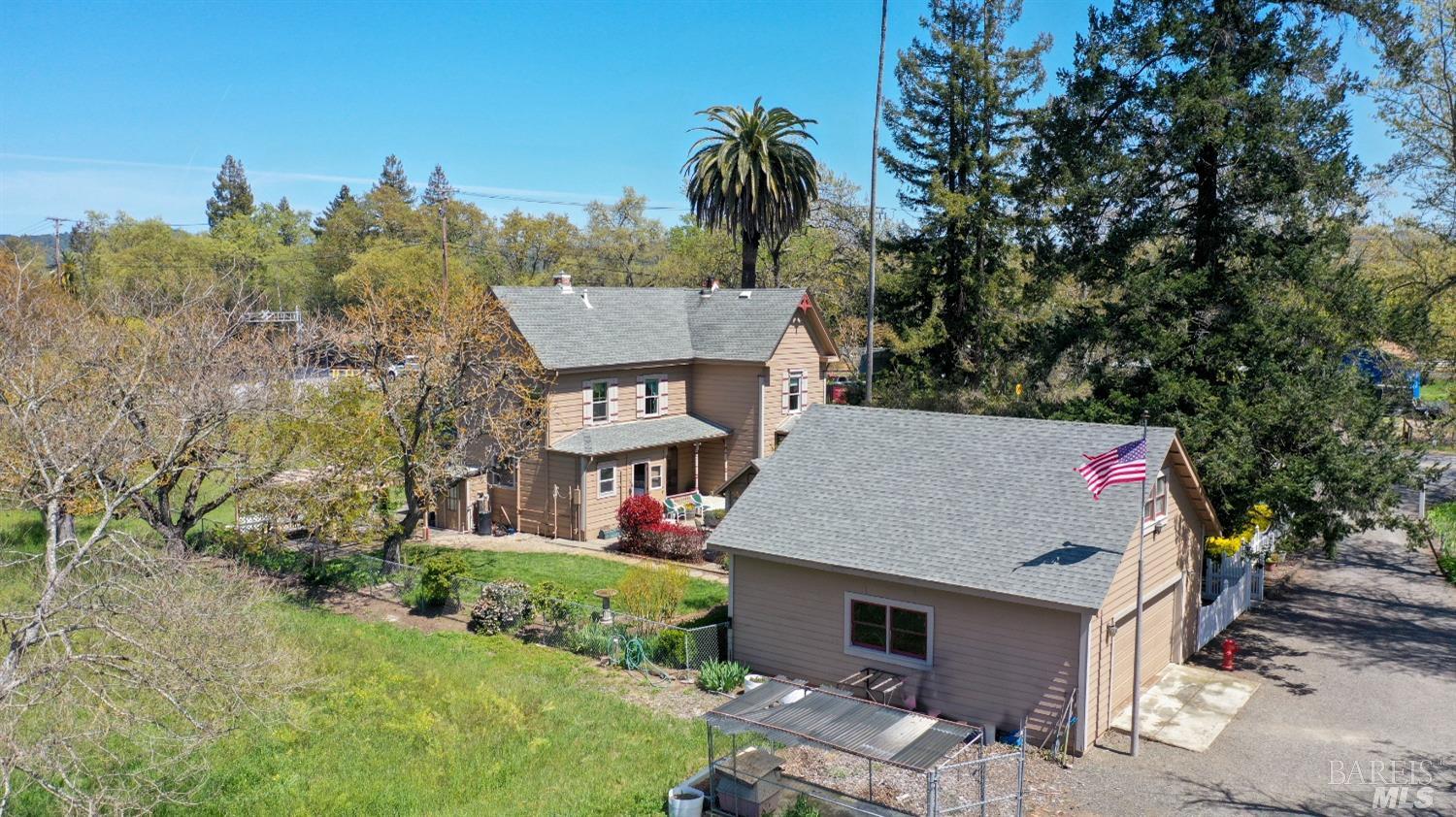 an aerial view of a house with a yard