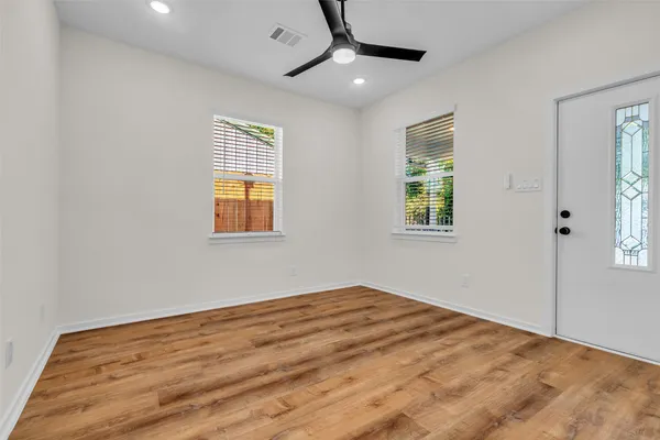 a view of empty room with windows