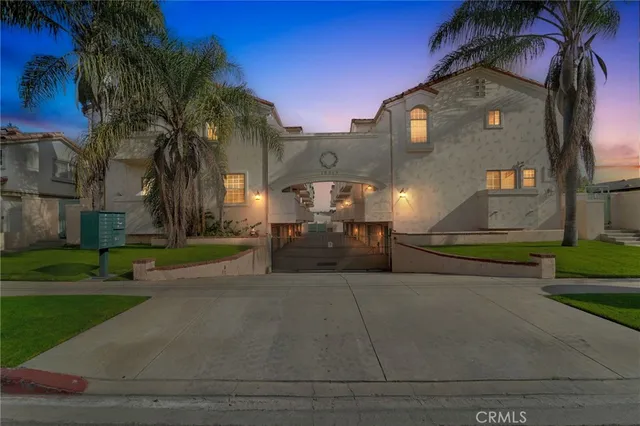 a couple of cars parked in front of building