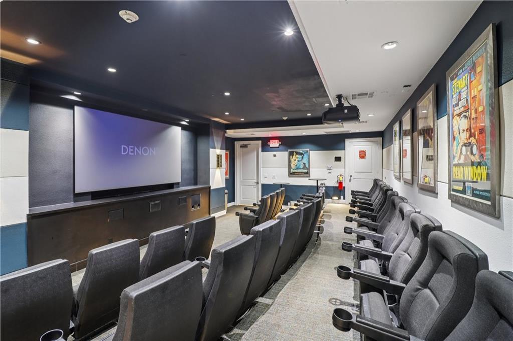 3445 Stratford Road Northeast, Unit 2602 Atlanta, GA 30326 - Photo 20 of 56 a media room with lots of chairs and a projector screen