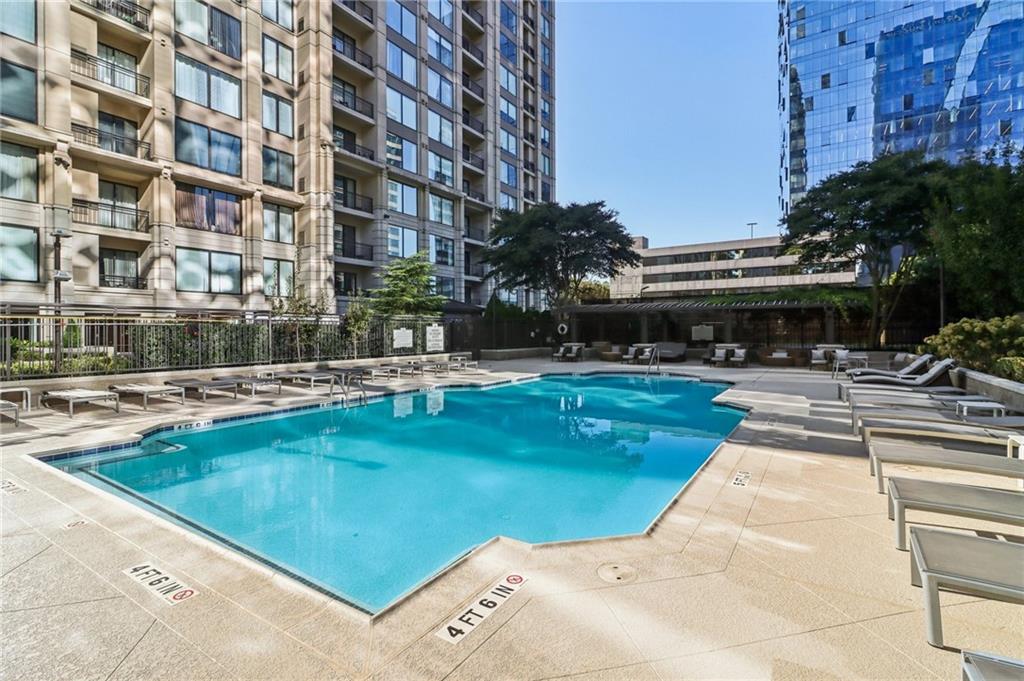 3445 Stratford Road Northeast, Unit 2602 Atlanta, GA 30326 - Photo 2 of 56 a swimming pool with outdoor seating and yard