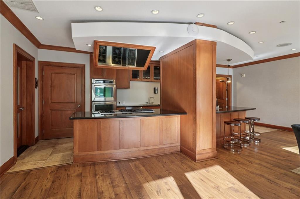 3445 Stratford Road Northeast, Unit 2602 Atlanta, GA 30326 - Photo 24 of 56 a living room with stainless steel appliances kitchen island granite countertop a refrigerator and a sink