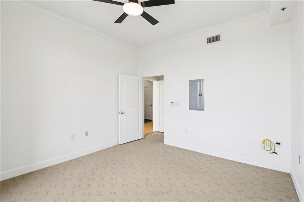 3445 Stratford Road Northeast, Unit 2602 Atlanta, GA 30326 - Photo 32 of 56 an empty room with fan