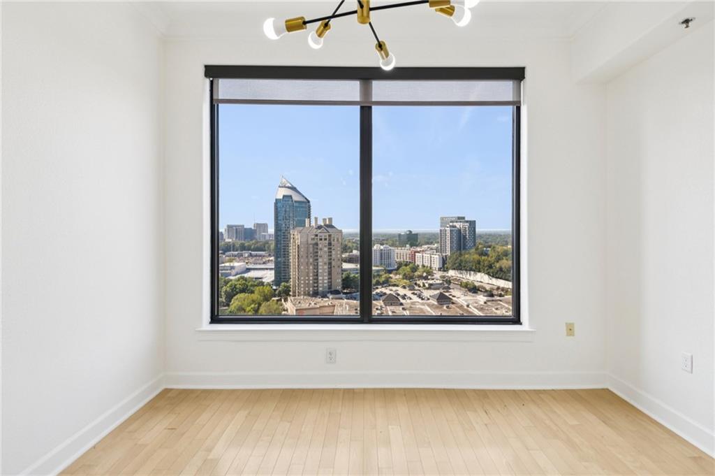 3445 Stratford Road Northeast, Unit 2602 Atlanta, GA 30326 - Photo 37 of 56 a view of a room with wooden floor and a window