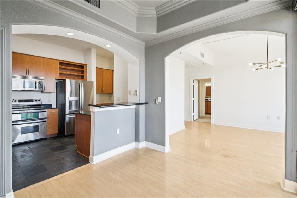 3445 Stratford Road Northeast, Unit 2602 Atlanta, GA 30326 - Photo 45 of 56 a view of a kitchen from the hallway