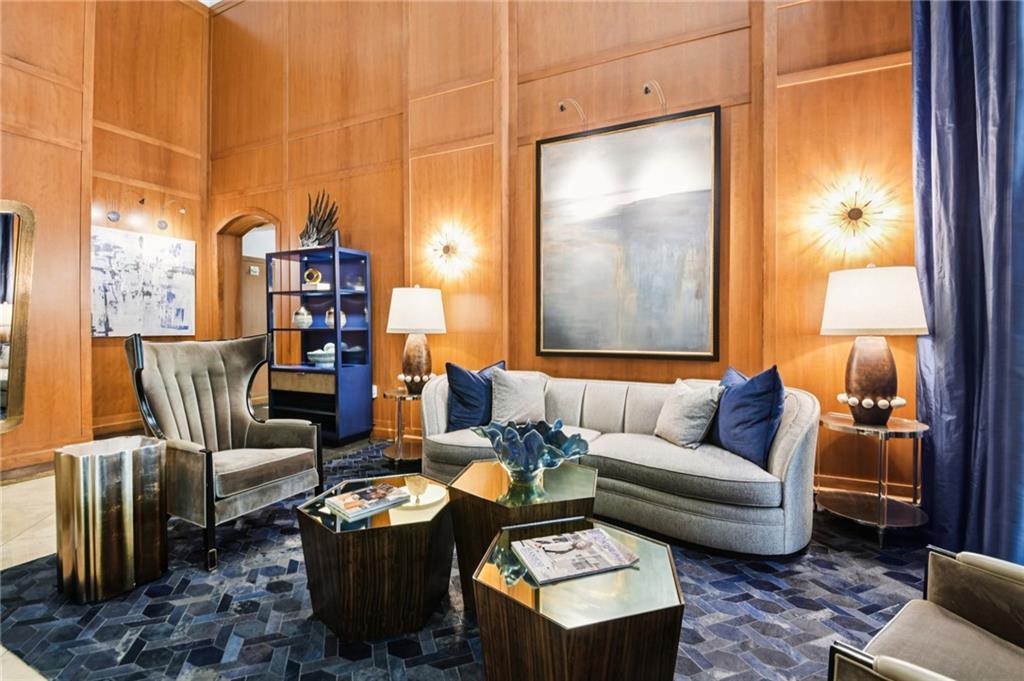 3445 Stratford Road Northeast, Unit 2602 Atlanta, GA 30326 - Photo 50 of 56 a living room with furniture a rug and a window