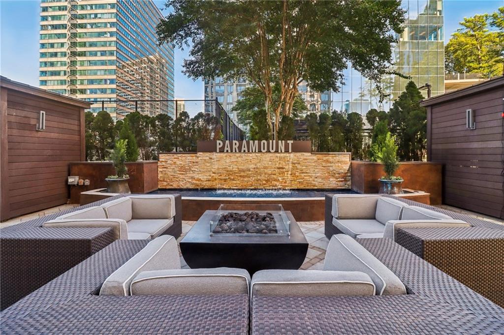 3445 Stratford Road Northeast, Unit 2602 Atlanta, GA 30326 - Photo 7 of 56 a view of a patio with couches table and chairs and potted plants