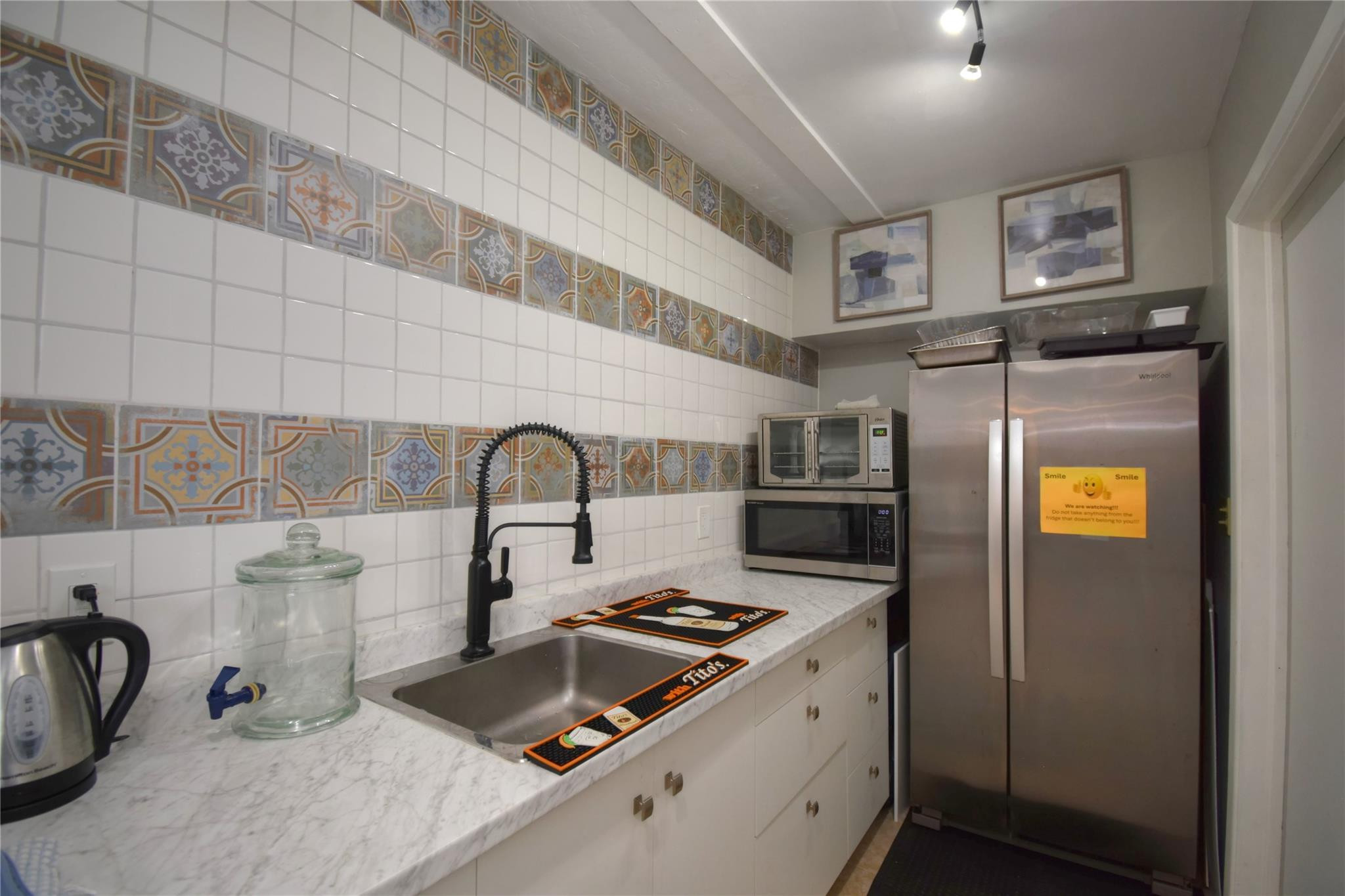 2161 Northeast 42nd Court, Unit 114 Lighthouse Point, FL 33064 - Photo 34 of 37 Clubhouse Kitchen