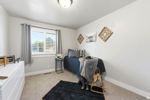 1405 Vintry Lane Murray, UT 84121 - Photo 19 of 44 Bright interior with neutral-toned walls and carpet flooring