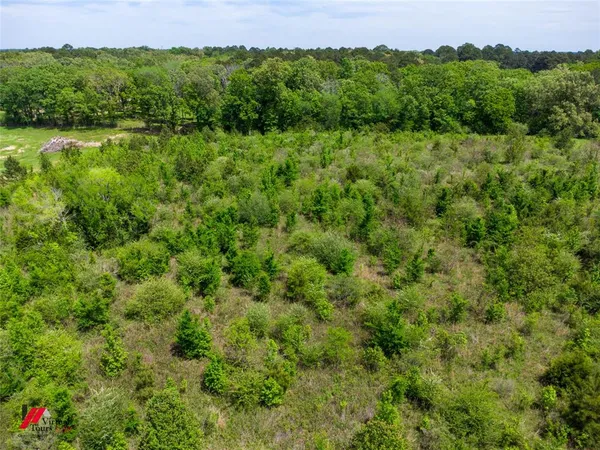a view of a lake with green space