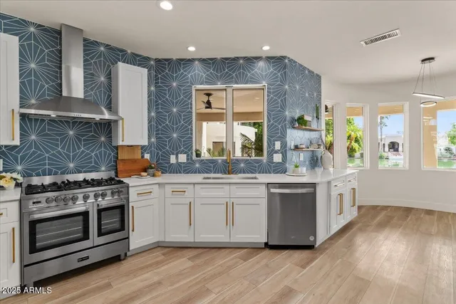 a kitchen with a sink and large window