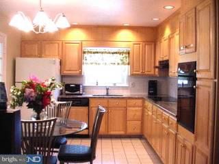 33 Quaker Road West Windsor, NJ 08550 - Photo 3 of 6 a kitchen with stainless steel appliances granite countertop sink microwave and cabinets