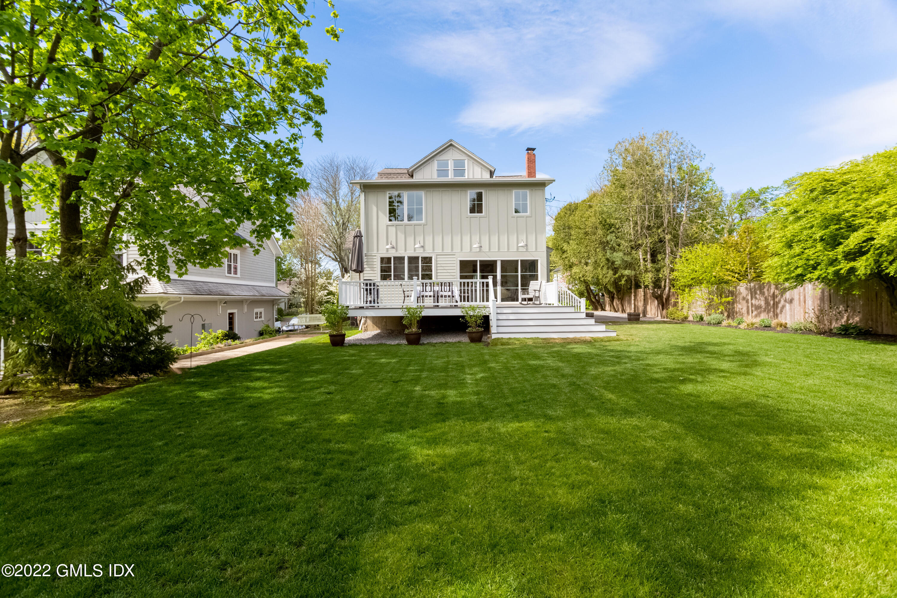 6 Chapel Lane Riverside, CT 06878 - Photo 28 of 29 a front view of a house with a garden and plants
