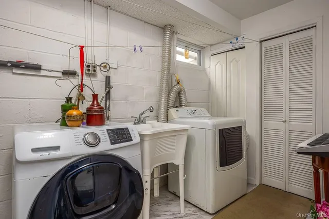 a utility room with dryer and washer