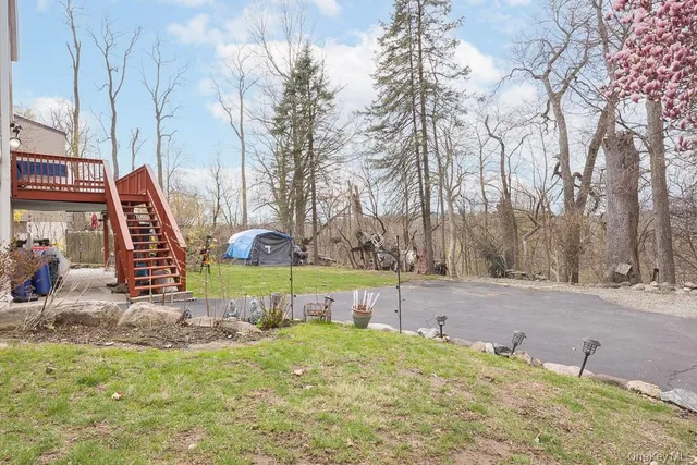 a view of a park with iron fence