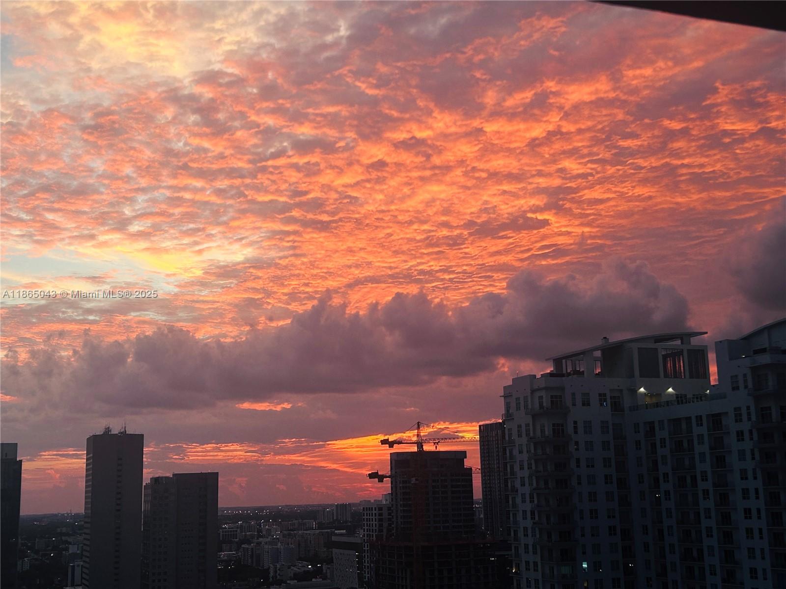 50 Biscayne Boulevard, Unit 3405 Miami, FL 33132 - Photo 21 of 40 a view of a city with sunset