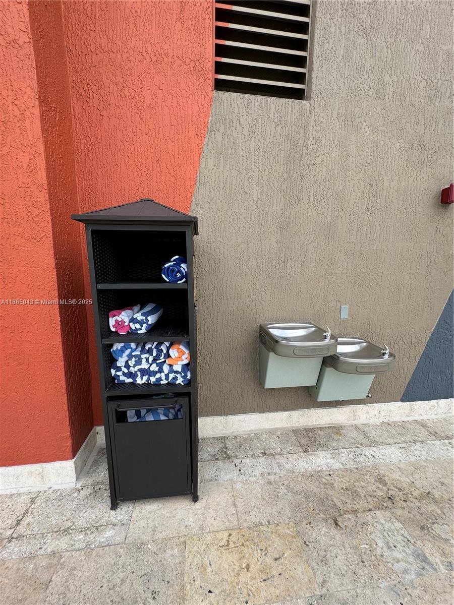 50 Biscayne Boulevard, Unit 3405 Miami, FL 33132 - Photo 35 of 40 a bathroom with a toilet and a shower curtain