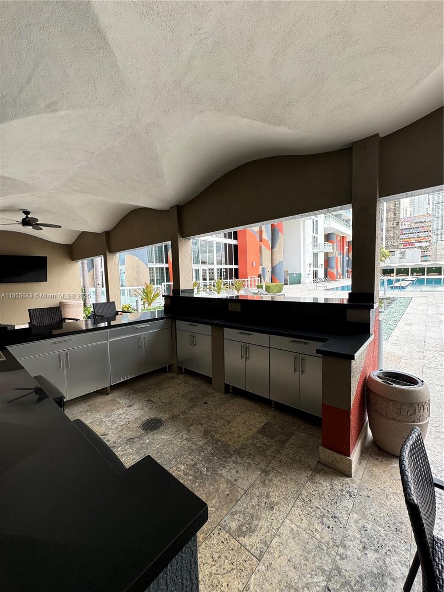 50 Biscayne Boulevard, Unit 3405 Miami, FL 33132 - Photo 36 of 40 a living room with a large window