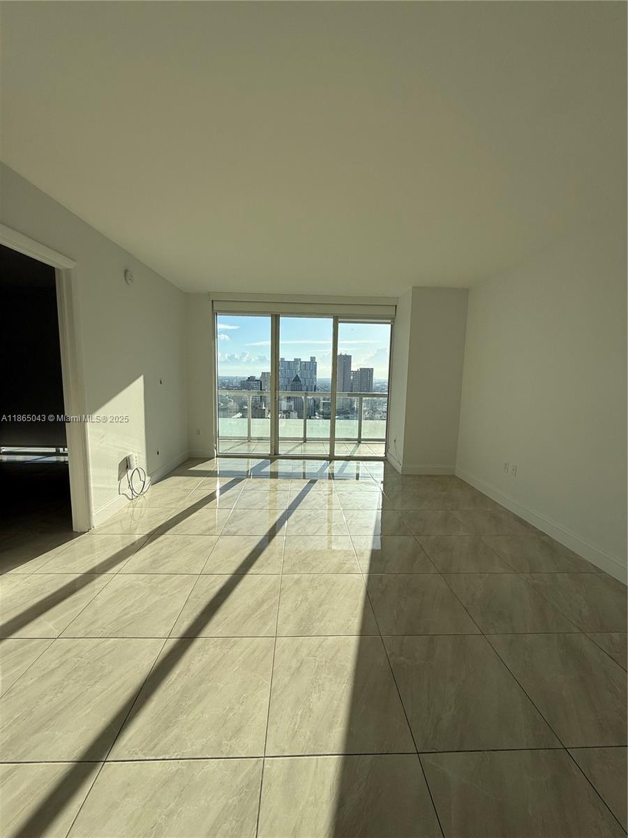 50 Biscayne Boulevard, Unit 3405 Miami, FL 33132 - Photo 6 of 40 a swimming pool with a large window