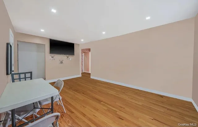a view of kitchen with cabinets and wooden floor