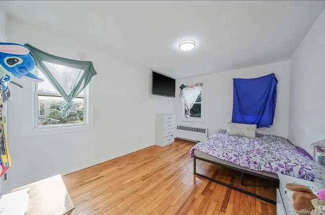 a living room with a bed and furniture