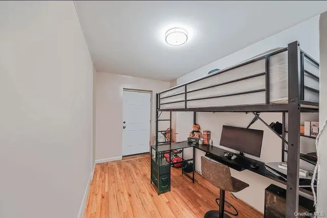 a room with wooden floor and furniture