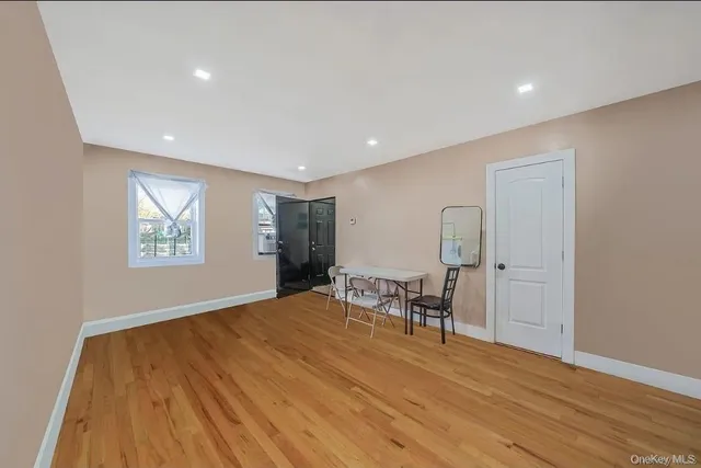 a view of room with furniture and wooden floor