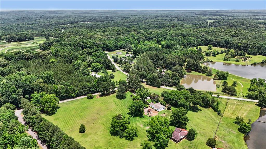 355 Inman Road Hampton, GA 30228 - Photo 2 of 47 an aerial view of a house with a yard