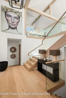 a bedroom with a large bed and a flat screen tv