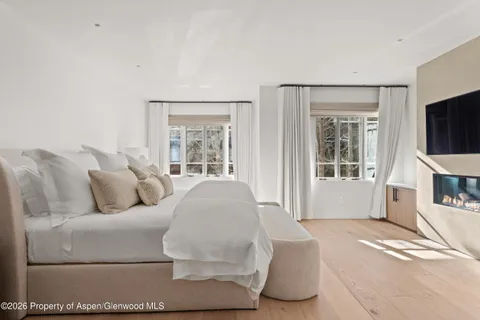 a room with a sink bed and window