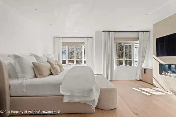 a room with a sink bed and window