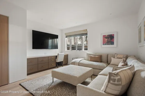a bedroom with a large bed and a couch