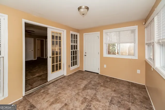 an empty room with windows