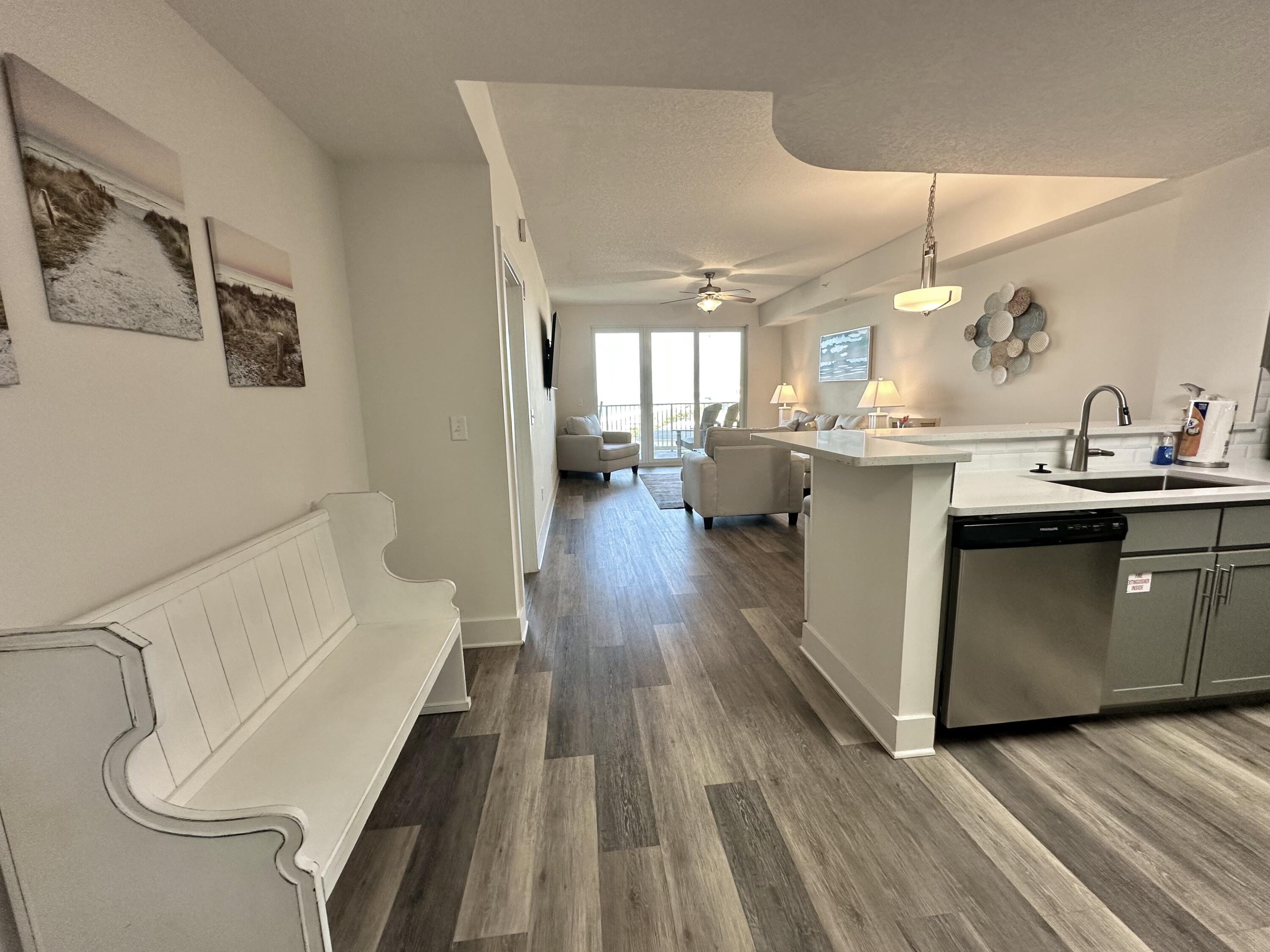 15928 Front Beach Road, Unit 3702 Panama City Beach, FL 32413 - Photo 13 of 85 a kitchen with a sink and wooden floor