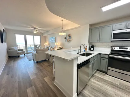 a view of two chairs in the balcony