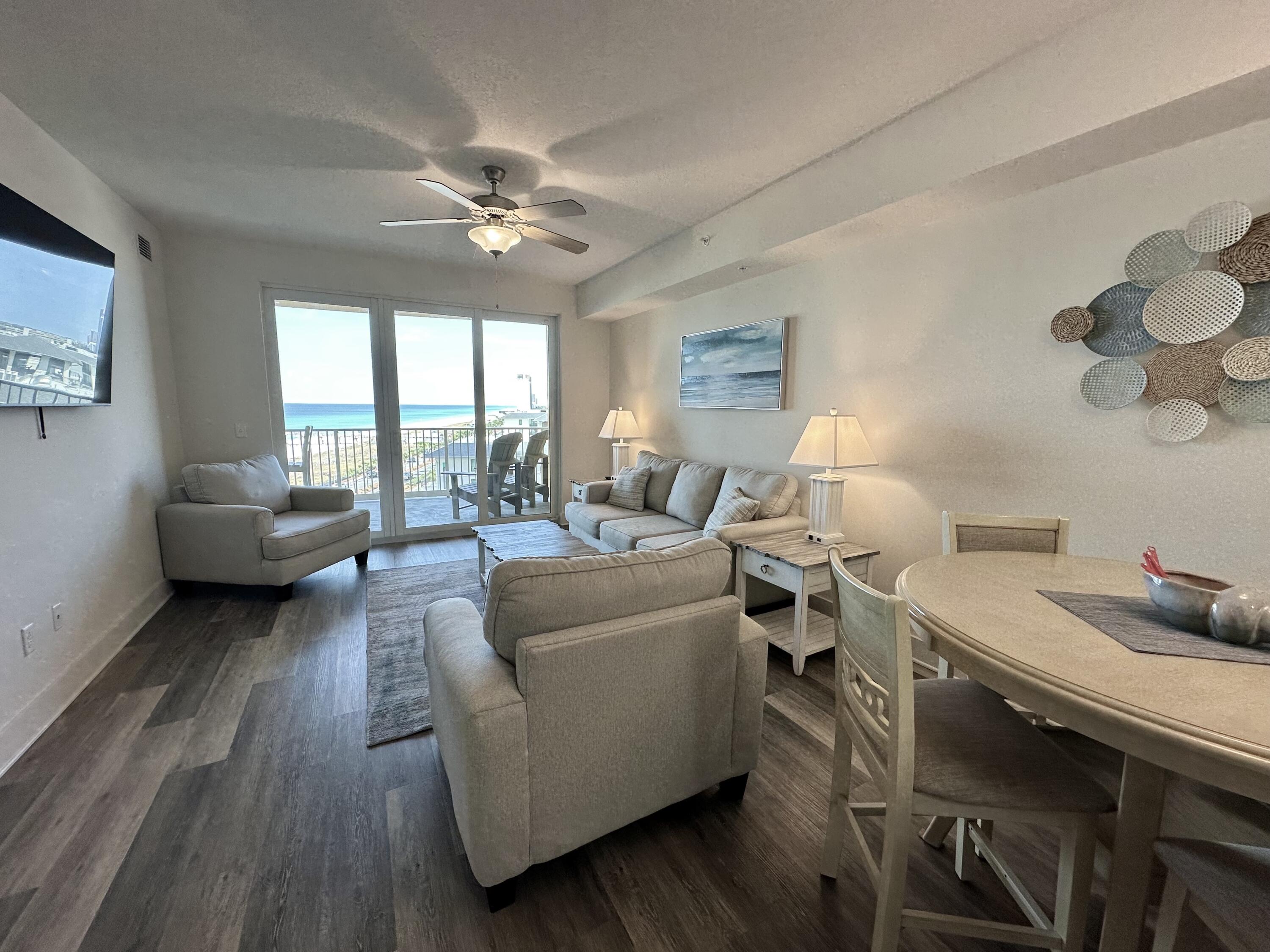15928 Front Beach Road, Unit 3702 Panama City Beach, FL 32413 - Photo 17 of 85 a living room with furniture and a large window