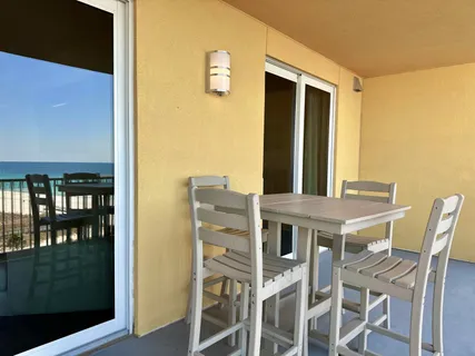 a living room with a bed and a walk in closet