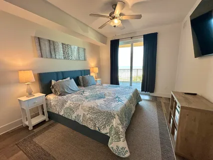 a kitchen with stainless steel appliances granite countertop a sink a stove a dining table and chairs